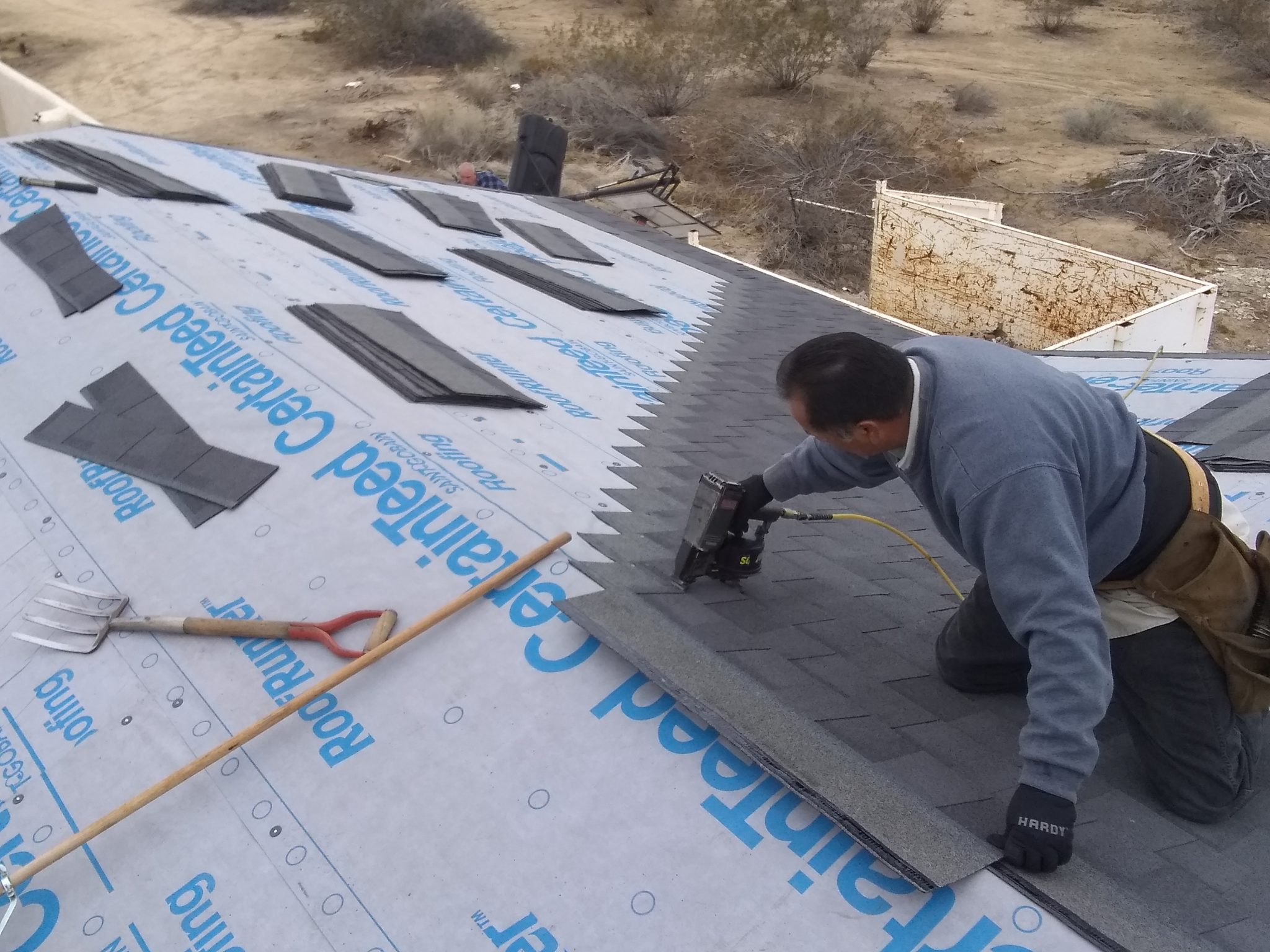 Roof Repair, Robert Gonzales with air hammer